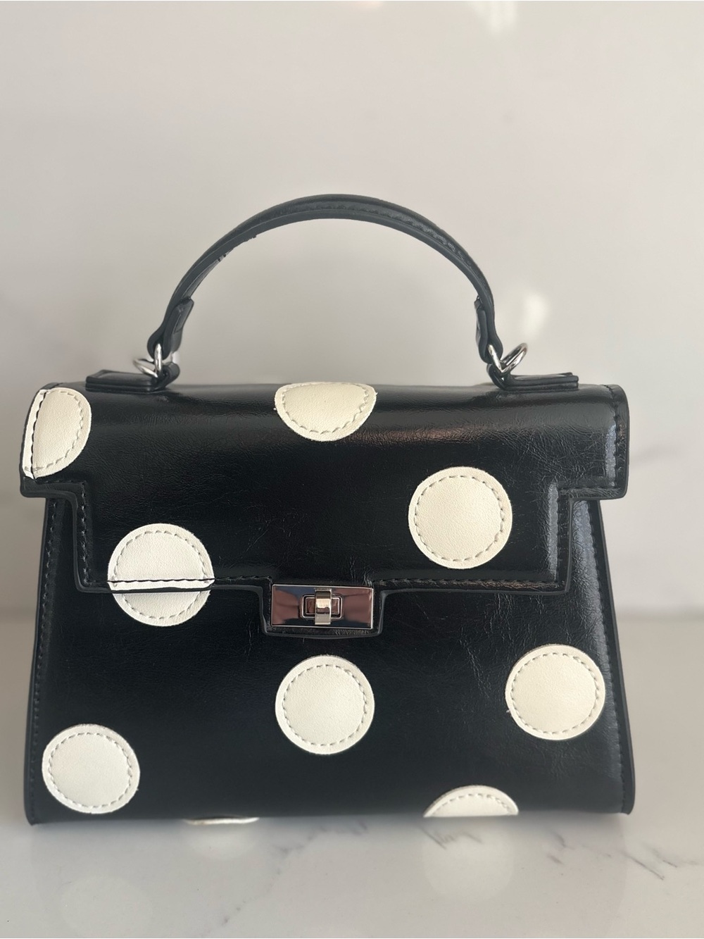 Melie Bianco Black Top-Handle Shoulder Bag with White Polka Dots